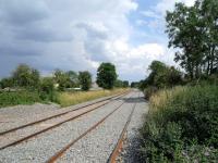 The redoubling of the Swindon to Kemble line is well underway and should be completed by 25 August 2014. View is south through the site of the former Purton station towards Swindon on 26 July. [Not quite on the scale of the Borders Railway or even the Airdrie - Bathgate project but round here it is looked upon as a minor miracle.]<br><br>[Peter Todd 25/07/2014]