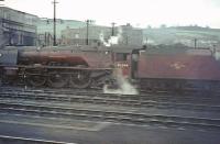 A grab shot from a train passing Perth shed on 16 May 1964 captures crimson lake liveried Stanier Pacific 46244 <I>King George VI</I> standing in the yard.<br><br>[John Robin 16/05/1964]