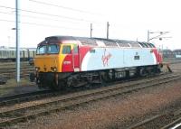 Virgin <I>Thunderbird</I> rescue locomotive no 57305 <I>John Tracy</I> stands in readiness in the sidings on the north side of Carstairs station in the spring of 2004.<br><br>[John Furnevel /03/2004]