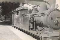 Driver G Cockburn poses for the photographer on the footplate of Holden F4 2-4-2 tank no 7164 at Fraserburgh in the summer of 1947. The train about to depart is the 4.15pm to St Combs. The 1907 Stratford built locomotive survived until August 1951, when it was withdrawn from Kittybrewster shed as BR 67164.<br><br>[G H Robin collection by courtesy of the Mitchell Library, Glasgow //1947]