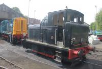 Barclay Class 01 0-4-0DM D2956, seen through the window of a passing ELR train, is the resident shunter at Castlecroft Goods in Bury. The 153hp loco dates from 1956 and after withdrawal in 1966 continued working in a scrapyard at Snailwell until 1984 when it was donated to the ELR. The Barclay is alongside Class 08 08164, which is in the final stages of an overhaul.   <br><br>[Mark Bartlett 26/07/2014]