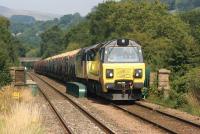 After having seen the Class 70 run downhill without effort, it was a different matter later in the journey when 70802 was working hard taking the 6V38 Carlisle to Chirk loaded log train with 56105 (dead) and 21 bogies up the hill approaching Langho station on 26 July 2014.<br><br>[John McIntyre 26/07/2014]