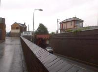 Another old-fashioned view of Coalville in July 2014, showing Mantle Lane signal box [see image 48056]. The Korean-made 4x4 passing under the bridge says as much about the changing distribution of industry and trade around the world as quite a few pictures of abandoned railways.<br><br>[Ken Strachan 04/07/2014]