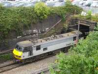 90043 <I>Freightliner Coatbridge</I> runs north light engine along the avoiding line beside Crewe station on 29 July. The locomotive is about to enter the tunnel under the former 5A Crewe North shed site to join the WCML beyond the Heritage Centre.<br><br>[David Pesterfield 29/07/2014]