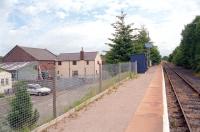 Standing on the platform at Broome in 2001, looking north east towards Craven Arms. The former goods shed survives as part of an industrial estate on the left.<br><br>[Ewan Crawford //2001]