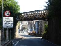 View north along the A5114 Glanhwfa Road, Llangefni, towards the town centre under the rail overbridge in July 2014. The line closed to all traffic in 1993.<br><br>[David Pesterfield 24/07/2014]