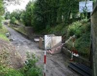 The old Eskbank station looking north east from the A6094 road bridge on 3 August 2014. [See image 48259]<br><br>[John Furnevel 03/08/2014]