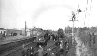 Local residents, railway enthusiasts and one eejit turn out at Leadburn station on 3 February 1962 to witness the visit of the SLS <I>Farewell to Peebles</I> railtour. The special, hauled by J37 0-6-0 no 64587, ran from Princes Street over the Peebles Loop, returning north via Galashiels to terminate at Waverley.<br><br>[David Stewart 03/02/1962]