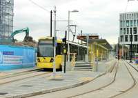 The newest addition to the Metrolink network is the 1km <I>street running</I> extension from Rochdale Railway station, down the hill into the town centre. Tram 3054 is at the new Rochdale tram terminus, which opened in March 2014, on a brief layover prior to returning to East Didsbury via Manchester. <br><br>[Mark Bartlett 07/08/2014]