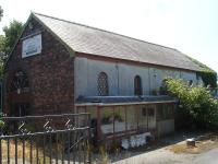 The former Amlwch goods shed appears disused at present.<br>
It is sited by the side of the A5025 Amlwch by-pass, just west the level crossing on that road [see image 48145], and alongside the caravan sales outlet on the former station site. A container storage operation occupies the goods yard. <br><br>[David Pesterfield 24/07/2014]