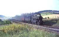 Castle class 4-6-0 no 7014 <I>Caerhays Castle</I> heading south through West Wycombe on 31 August 1964. The Tyseley based locomotive was substituting for a failed diesel on a Birmingham Snow Hill - London Paddington service. <br><br>[John Robin 31/08/1964]