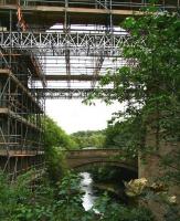 Looking north east along the River South Esk through one of the arches of Newbattle Viaduct on 10 August 2014. The car in the centre is heading for Hardengreen Roundabout on the A7. The South Esk is heading for the Forth at Musselburgh, after meeting up with its good friend the North Esk just beyond Dalkeith.<br><br>[John Furnevel 10/08/2014]