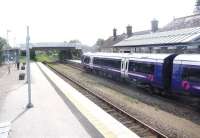 View south at Inverurie station on 8 August 2014 as the 13.33 service for Aberdeen preares to depart.<br><br>[Jim Peebles 08/08/2014]