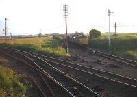 37078+37067 arriving off the Stanhope and Tyne route at Washington South Junction in the late 1970s with a train of iron ore empties from Consett. The train will reverse in Washington sidings before heading south to Redcar, which had replaced Tyne Dock as the ore import terminal from 1974 until final closure of the steelworks in 1980.<br><br>[Ewan Crawford Collection //]