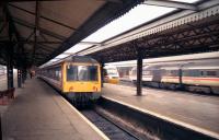 A Newbury and Bedwyn stopping service waits in west bay platform 7 at Reading in September 1991 as an eastbound HST calls at the adjacent platform and another rushes past on the through line heading for Paddington.<br><br>[John McIntyre /09/1991]