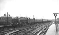 A thoroughly wet and miserable morning at Carlisle on 21 August 1965 as Warrington (Dallam) Black 5 no 45375 brings the 6am Warrington - Carlisle stopping train into the south end of the station.  <br><br>[K A Gray 21/08/1965]