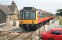 A westbound DMU on the level crossing at Longforgan in 1989.<br><br>[Ewan Crawford //1989]