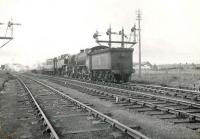 A train arriving at Fraserburgh on 6 August 1954. The locomotives are Gresley K2 2-6-0 61779 and BR Standard 2-6-4 tank 80021. Double heading of passenger trains was used to bring in locomotives for the extra fish trains required during the herring season. <br><br>[G H Robin collection by courtesy of the Mitchell Library, Glasgow 06/08/1954]