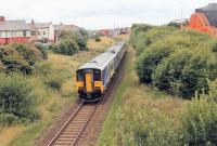 A <I>Pacer/Sprinter</I> combination runs along the level track between Blackpool South and Blackpool Pleasure Beach stations, passing another set of tracks that are a little more undulating. Personally, I'm not so sure about the Big Dipper's new orange paint and preferred the previous traditional colour scheme [See image 23554].<br><br>[Mark Bartlett 16/08/2014]