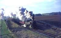 Hard working BR Standard class 4 tank no 80063 climbs towards Bogton Bridge, south east of Thorntonhall, on 25 May 1965. <br><br>[John Robin 25/05/1965]