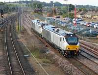 Two brand new Class 68s, 68011 and 68010, in Chiltern Trains livery, running light engine from Crewe to Carlisle on 20th August 2014.<br><br>[Mark Bartlett 20/08/2014]