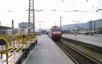 View west at Wurzburg in June 1990 with three types of electric locomotive in the station. From left to right are members of classes 103, 120 and 141. Note the yellow Deutsche Bundespost mail trolleys on the left waiting for the next set of mail bags.<br><br>[John McIntyre /06/1990]