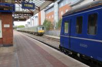 An unusual scene on the national network but a daily event at Aylesbury in the summer of 2014. Class 121 55020 waits to leave with the 17:30 to Princes Risborough. Stabled in the sidings is a Class 117 unit now used for water jetting and two more Class 121 units 55032 and 977873, neither of which are in passenger service.<br><br>[Malcolm Chattwood 15/08/2014]