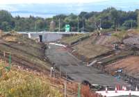 The Borders Railway trackbed running south from Shawfair towards the bridge carrying the City Bypass, with Sheriffhall roundabout just off picture to the right. Photograph taken on Sunday 24 August 2014 from the realigned A6106 road.<br><br>[John Furnevel 24/08/2014]