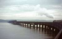 <h4><a href='/locations/T/Tay_Bridge'>Tay Bridge</a></h4><p><small><a href='/companies/T/Tay_Bridge_and_Associated_Lines_North_British_Railway'>Tay Bridge and Associated Lines (North British Railway)</a></small></p><p>Gresley A3 Pacific no 4472 <I>Flying Scotsman</I> runs out onto the Tay Bridge on 16 May 1964 with the Queens College RTS <I>'Flying Scotsman Railtour'</I>. 24/132</p><p>16/05/1964<br><small><a href='/contributors/John_Robin'>John Robin</a></small></p>