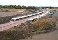 The platforms of Shawfair station on Sunday 24 August 2014 looking south, with ballast now laid along the formation and levelling of the car park area underway on the left.<br><br>[John Furnevel 24/08/2014]