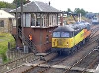 Having spent the weekend at Bo'ness, Colas 56094 leaves on 25 August to return to main line duties.  The signalman is about to hand over the token. <br><br>[Bill Roberton 25/08/2014]