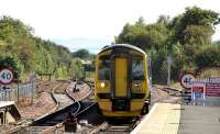 A 158 bound for Cowdenbeath arrives at Dalmeny on 26 August.<br><br>[Colin Miller 26/08/2014]