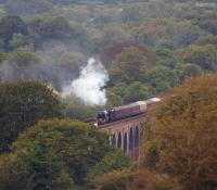 The return <I>Fellsman</I> railtour crossing Whalley viaduct on the very dull evening of 27 August 2014. Black 5 no. 45231 was entrusted with the working without diesel backup and a fine job it made of it too. The train is about to start the ascent of Wilpshire bank.<br><br>[John McIntyre 27/08/2014]