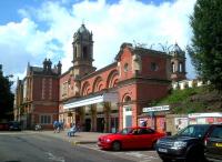 Bury St Edmunds station appears to be immaculate, until you notice the buddleia growing out of the gutters. The excursion train in the far platform on 6 August is the Pathfinder Tours <I>Anglian Explorer</I>.<br><br>[Ken Strachan 06/08/2014]