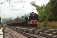 The outward run of the <I>Cumbrian Mountain Express</I> on 30 August 2014 from Crewe to Carlisle via Manchester, Bolton, Wigan and the S&C. The train was hauled by Stanier Pacific 46233 <I>Duchess of Sutherland</I>. The tour is seen here being routed along the Down Slow line at Balshaw Lane Junction, in weather conditions hardly befitting a Duchess.<br><br>[John McIntyre 30/08/2014]