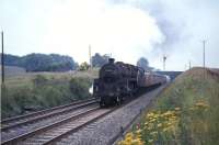 The 10am Dundee - Glasgow train photographed near Cumbernauld on 3 August 1965 behind Standard class 5 4-6-0 no 73151. <br><br>[G W Robin 03/08/1965]