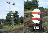 The down starter at Appleby is off for the passage of northbound coal empties on 17 July 2014. The subsidiary arm once controlled the connection between the MR and NER lines but now only gives access to the Network Rail maintenance yard. The two disc-type ground signals control access to the yard and the up main to down main crossover.<br><br>[Bill Jamieson 17/07/2014]