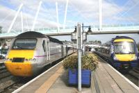 The southbound <I>Highland Chieftain</I> about to leave Stirling platform 3 on 1 September 2014. The DMU waiting in bay platform 7 will form the 11:23 service to Glasgow Queen Street.<br><br>[Colin McDonald 01/09/2014]