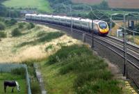 A southbound Virgin Pendolino service passing Bugbrooke, Northants, on the WCML between Weedon and Blisworth, on 21 August 2014.<br><br>[John Steven 21/08/2014]