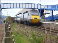 43306 brings up the rear of the 09.52 East Coast service to Kings Cross as it departs Leuchars on 2 September 2014. In the foreground is the stub of the branch that latterly served RAF Leuchars, fully signalled but disconnected by removal of the turnout crossing. [See image 33603]<br><br>[Bill Roberton 02/09/2014]