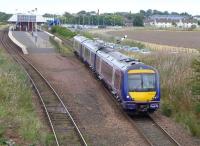 170423 leaves Leuchars on 2 September 2014 with the 11.34 Dundee - Edinburgh.<br><br>[Bill Roberton 02/09/2014]