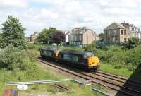 Light engine movement on the Morecambe branch as 37603 and 37602 make their way towards Heysham to collect a reprocessing load for Sellafield. This picture taken from York Bridge, which carries the road to Lancaster out of the town. The land in the foreground was once occupied by carriage sidings used for stabling excursions to the resort.  <br><br>[Mark Bartlett 03/06/2014]