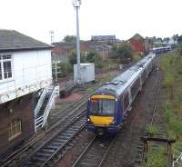 ScotRail Turbostar 170416 forms the 16.21 departure to Aberdeen ex Glasgow, having just passed the corresponding southbound service. The latter is entering the station in the background as the 16.24 to Queen Street. Seen from the footbridge at Wellgate level crossing, with Arbroath North signal box on the left.  <br><br>[Andrew Wilson 05/09/2014]