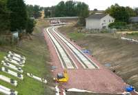 Looking north towards Shawfair station on 7 September 2014. Beyond the platforms is the new overbridge carrying the link from Millerhill Road which will give access to car parking facilities etc on the east side of the line.<br><br>[John Furnevel 07/09/2014]