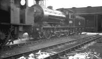 J27 no 65878 stands in the snow on Darlington shed, thought to be in the early 1960s, looking like an ex-works visitor. The 0-6-0 ended its days at North Blyth from where it was eventually withdrawn in Ocober 1964 to be cut up in the yard of Hughes Bolckow at nearby Battleship Wharf.<br><br>[K A Gray //]