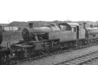 Steam locomotives stored in the sidings alongside Hurlford shed in April 1962, including Stanier 2-6-2T no 40151. The locomotive was officially withdrawn from 67B at the end of that year and was disposed of through MMS Wishaw in December 1963. <br><br>[David Stewart 17/04/1962]