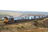 68004 <I>Rapid</I> failed on the way north to Inverness on 11 September with the 4D47 container train. 66425 was sent as a replacement and the train, including the broken down Class 68, arrived very late in Inverness. The return working left Inverness at 19:15 and is pictured just off Culloden Viaduct.<br><br>[John Gray 11/09/2014]