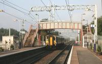 156478 leaves Mount Vernon Station for Glasgow Central High level on a sunny 11th September 2014, with the OHLE wiring installation now complete. <br><br>[Colin McDonald 11/09/2014]