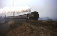 BR Standard tank 80120 climbs up towards the main line at Busby Junction in April 1966 with a morning train from East Kilbride heading for Glasgow.<br><br>[John Robin /04/1966]