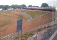 The Pathfinder Tours <I>Anglian Explorer</I> heads towards Felixstowe docks on 6 August via Bacon Factory curve. This recently constructed curve should increase traffic on the Nuneaton North Chord - eventually.<br><br>[Ken Strachan 06/08/2014]